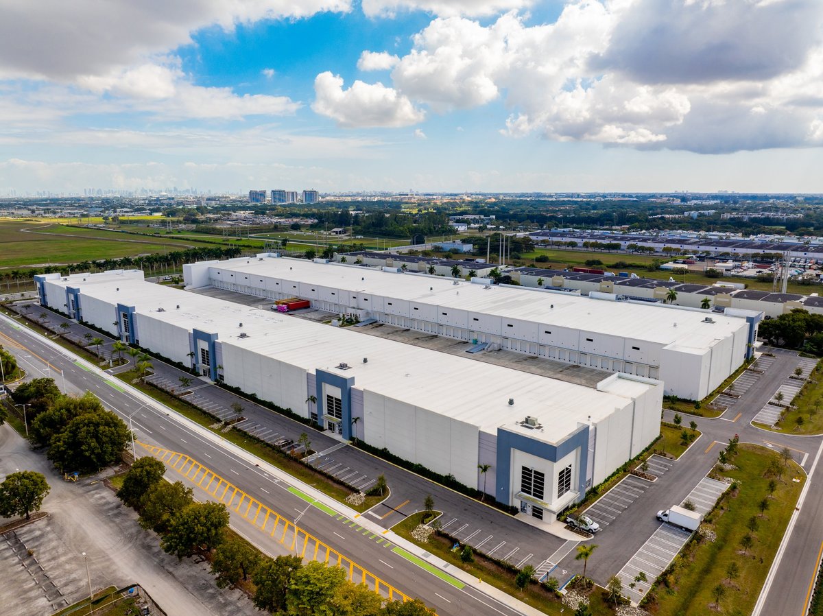 Aerial view of warehouse with solar panels