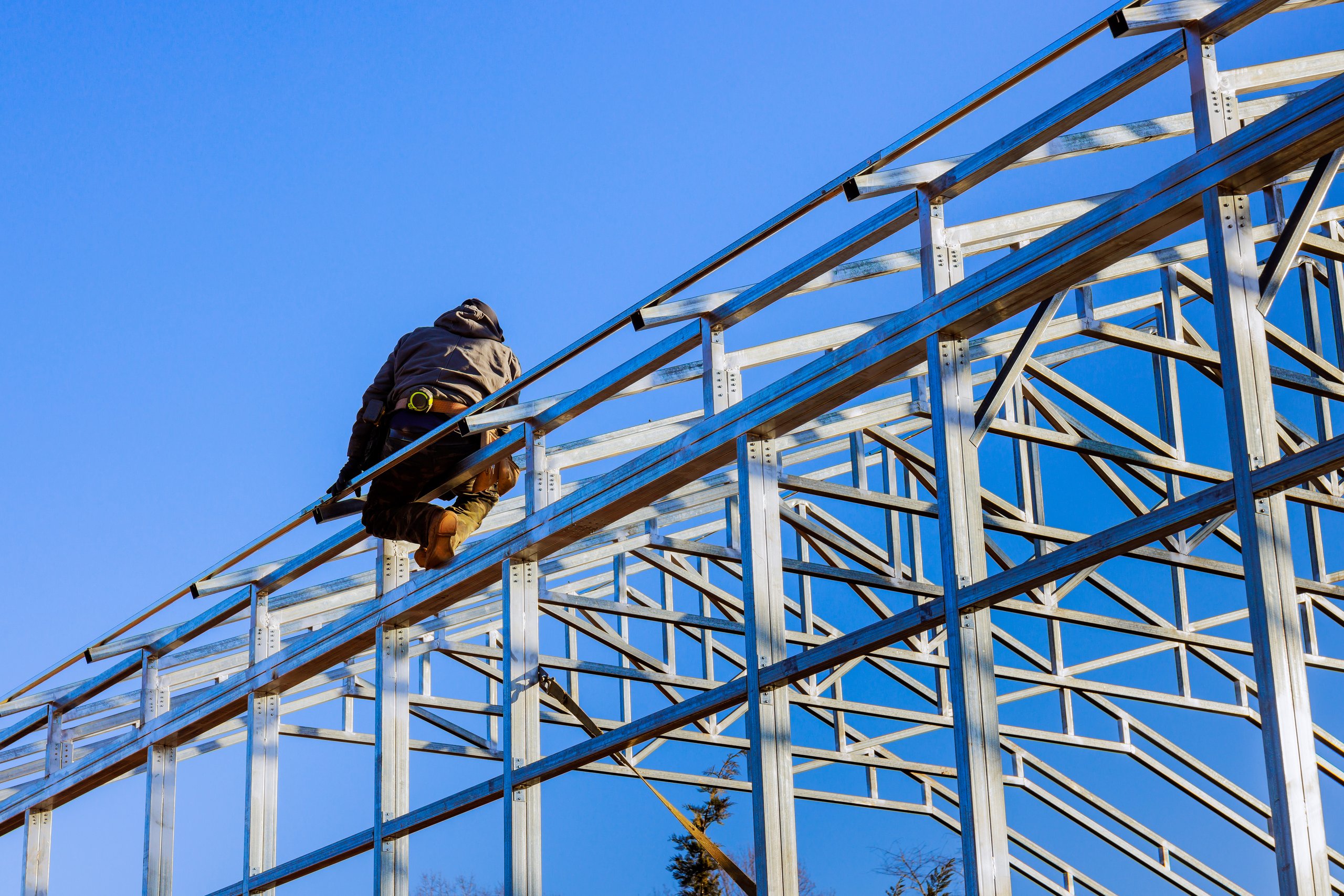 Construction workers assembling steel structure