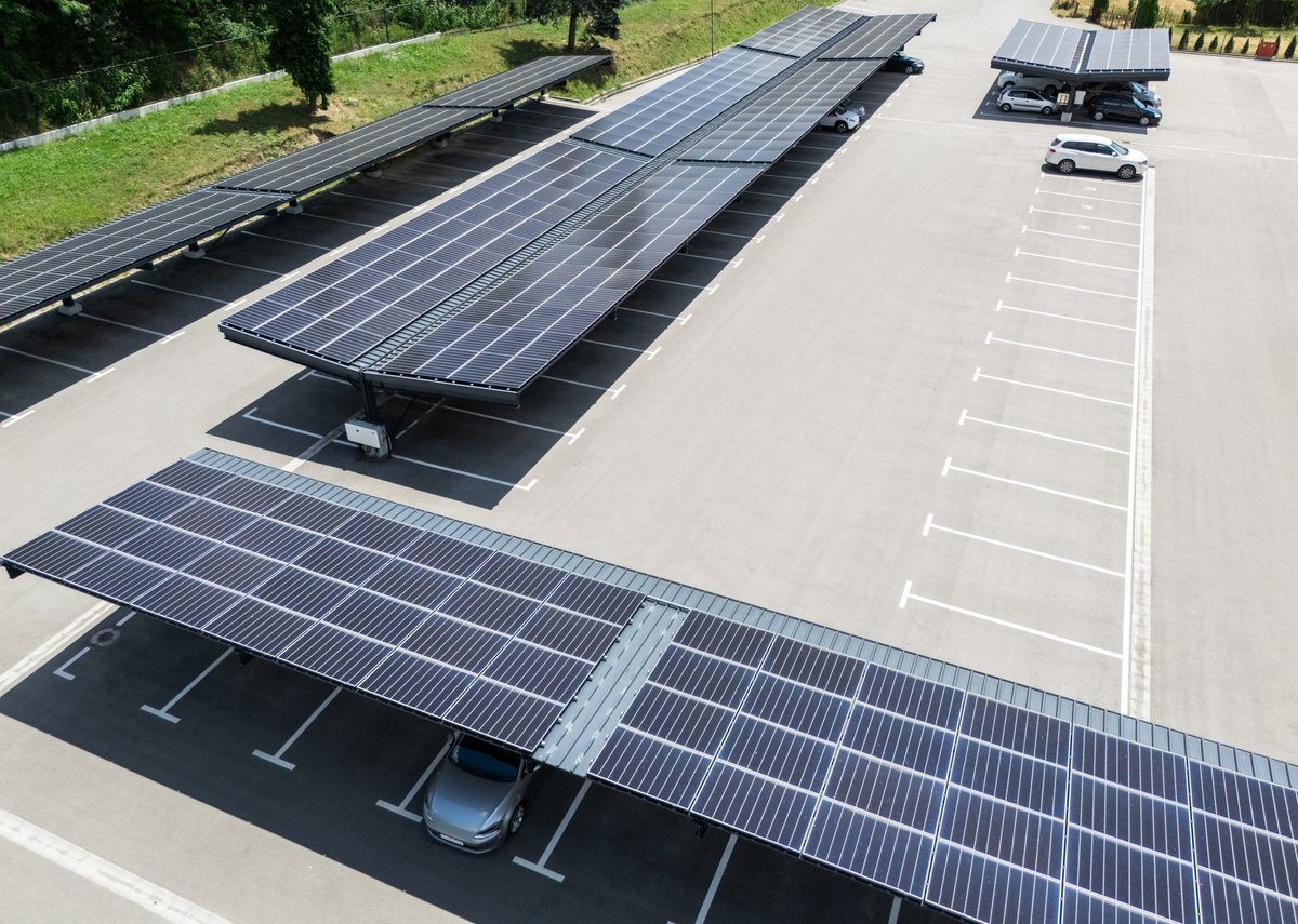 Aerial view of parking space with solar canopies