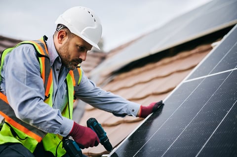 Professional solar panel installation on commercial roof