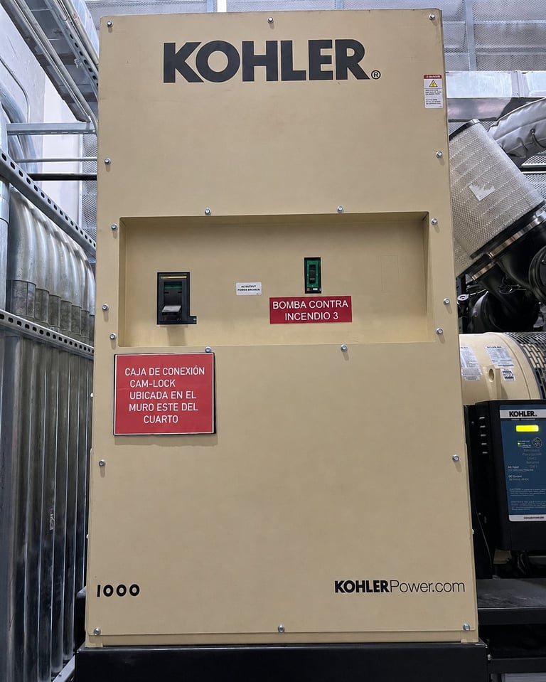 Beige Kohler Power generator unit mounted on wall with Spanish warning labels and control panel